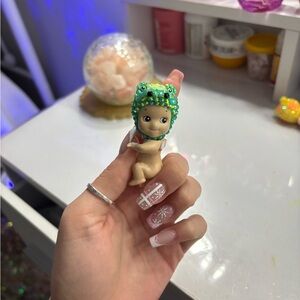 Charming Baby Doll with Green Frog Hat